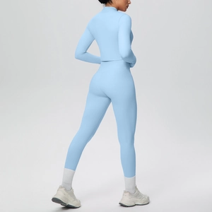 Three-piece sky blue yoga set featuring a zip jacket and high-waist leggings from a back view