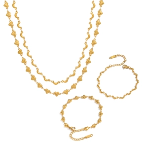 Golden stainless steel jewelry set featuring heart and moon pendant necklaces and bracelets