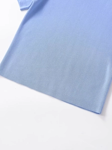 Detailed close-up of light blue knitted top hem and texture with soft fabric finish