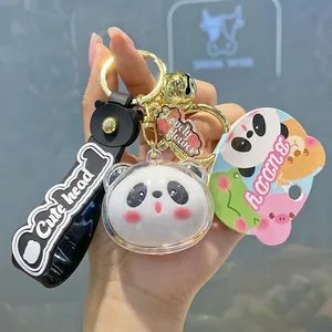 Cute panda head acrylic keychain with black rubber strap and golden bell accessory