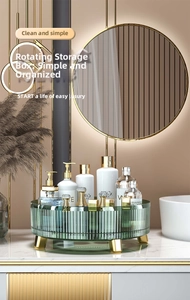 Detail of emerald green rotating makeup organizer with gold metal feet on a vanity