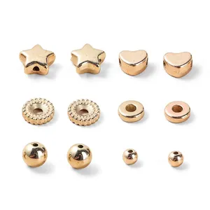 Gold plated acrylic beads collection featuring hearts, stars and spacer shapes for DIY jewelry
