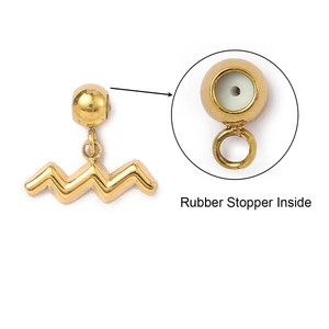 Macro detail of gold Aquarius charm featuring rubber stopper inside for DIY necklaces