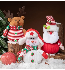 Three plush knitted Christmas characters: Reindeer, Snowman, and Santa Claus gift dolls