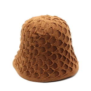 Detailed macro view of heavy-duty crochet knit texture on this caramel sun hat for women
