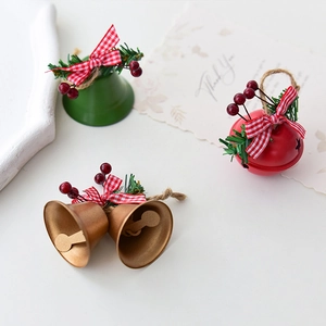 Festive Christmas iron bells set with bows and pine needles for tree decoration