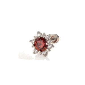 Silver flower stud earring with a central red round stone and white zircon accents