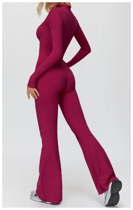 Slim fit fleece-lined yoga jumpsuit in plum purple with long sleeves and flared legs