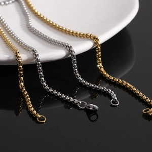 Close-up of gold and silver stainless steel box chains with secure lobster clasps