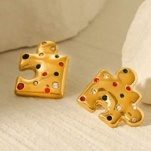 18k gold plated puzzle shape earrings with colorful zircon inlay on stone surface