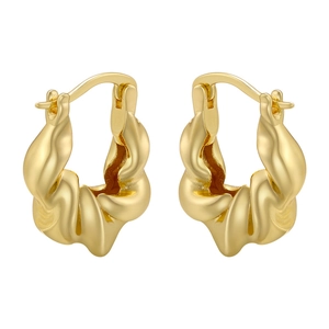 Detail view of 18K gold plated twisted hoop earrings with a sculptural glossy finish