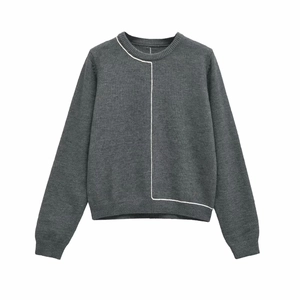 Detail of grey crewneck knit sweater with white asymmetric contrast line and ribbed cuffs