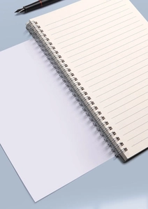 Close-up of metal spiral binding and ruled pages of a B5 minimalist notebook with pen