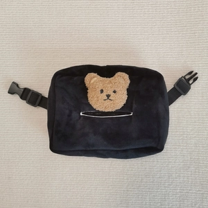 Detail of plush black car tissue holder with brown teddy bear and adjustable strap