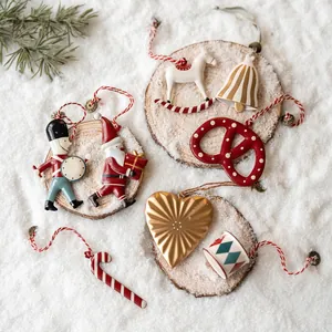 Nordic Christmas tree ornaments set with Santa, bells, and stars on rustic wood base