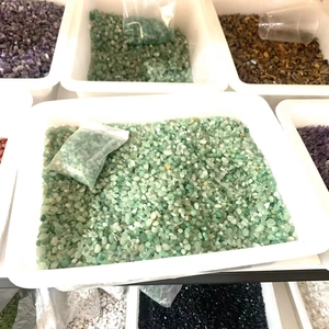 Bulk green aventurine crystals in storage tray for home decor and jewelry making