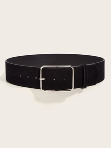 Detailed view of a wide black suede belt with a large silver metal buckle on white display