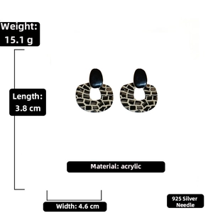Detail view of retro acrylic zebra print earrings with size and weight measurements