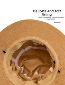 Detail of cotton sweatband and interior stitching on a yellow sun hat with soft lining