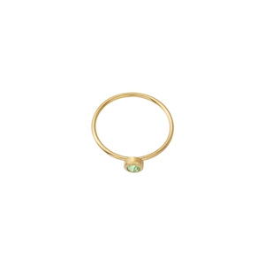 Close-up of minimalist gold ring with round green birthstone in bezel setting
