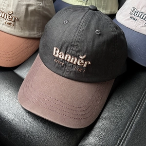 Close-up of vintage letter embroidery and high-quality cotton twill texture on baseball caps