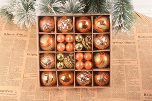 Vertical view of 42 bronze and gold Christmas ornaments in various textures and finishes