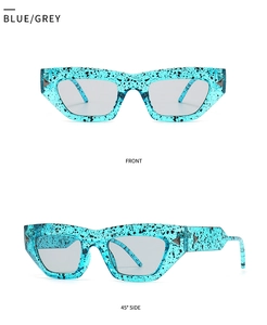 Front and 45-degree side views of blue patterned cat-eye glasses with grey lenses