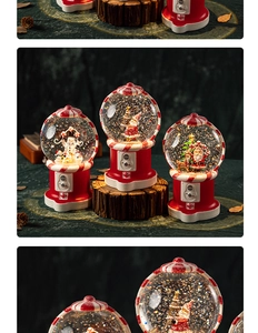 Three Christmas snow globe music boxes with Santa and Snowman on a wooden base