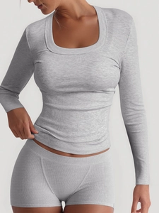 Close-up of grey ribbed knit texture and U-neck design on a sporty long sleeve top