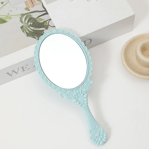 Light blue handheld makeup mirror with European vintage embossed floral patterns