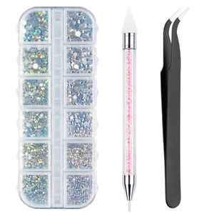 Detailed view of nail art tool kit with acrylic rhinestones, pink picker pen and tweezers