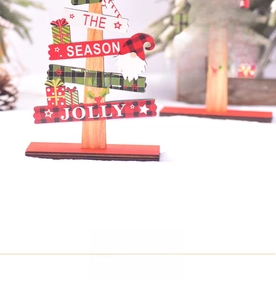 Detail of wooden Christmas gnome signs with red and green plaques on rustic bases