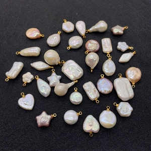 Variety of irregular baroque pearl pendants in heart and star shapes with gold loops