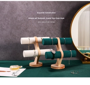 Dual-tier wooden jewelry stand set with velvet bars displaying bracelets and a watch