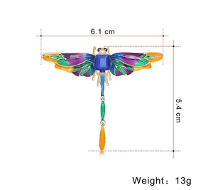 Detailed view of colorful enamel dragonfly brooch with size labels 6.1cm and 5.4cm