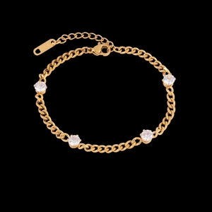 Elegant 18K gold plated chain bracelet with four zircon stones on black background