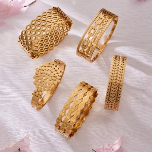 Set of five 18k gold plated hollow geometric bangles with zircon and filigree patterns