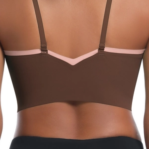 Detail of cross-back yoga bra with dual-tone design and adjustable slim straps