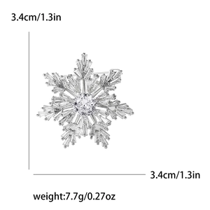 Detail view of silver snowflake brooch with dimensions 3.4cm and weight 7.7g