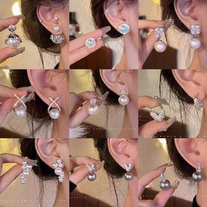 Collection of elegant gold plated pearl earrings with sparkling diamond studs for women
