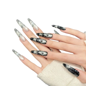 Gothic stiletto press-on nails with black and white gradient and silver cross designs