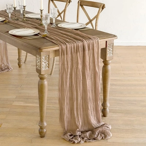 Dusty rose cheesecloth table runner with rustic boho pleats for wedding decor