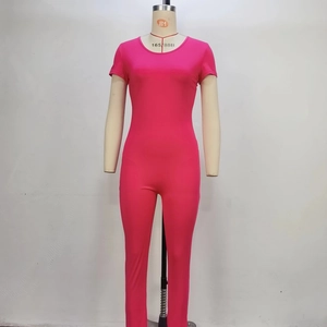 Detailed view of the rose red backless short sleeve athletic bodysuit on a mannequin