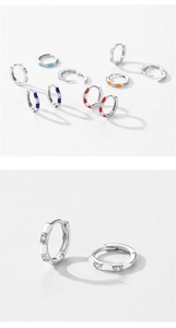 Macro detail of S925 sterling silver hoop earrings with colorful enamel and diamonds