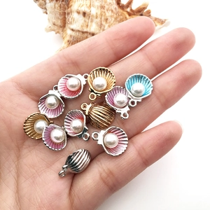 Handheld shell pearl pendants in colorful enamel and metallic finishes for DIY jewelry