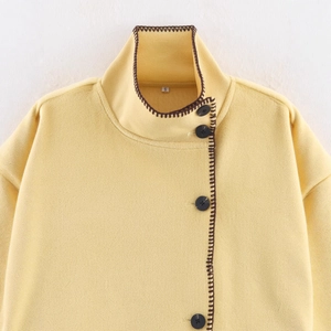 French style yellow wool cape jacket with black buttons and contrast stitching details