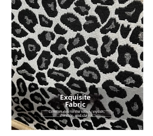 Detailed close-up of premium leopard print woven fabric with durable black and beige texture