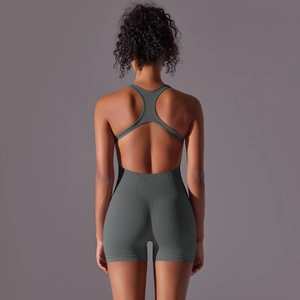 Detailed back view of backless yoga jumpsuit with ribbed texture and racerback straps