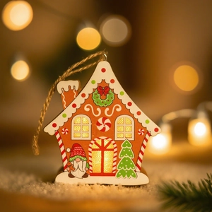 Macro shot of illuminated wooden gingerbread house ornament with warm LED light and gnome