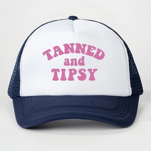 Detailed front view of navy and white mesh trucker hat with pink TANNED and TIPSY print